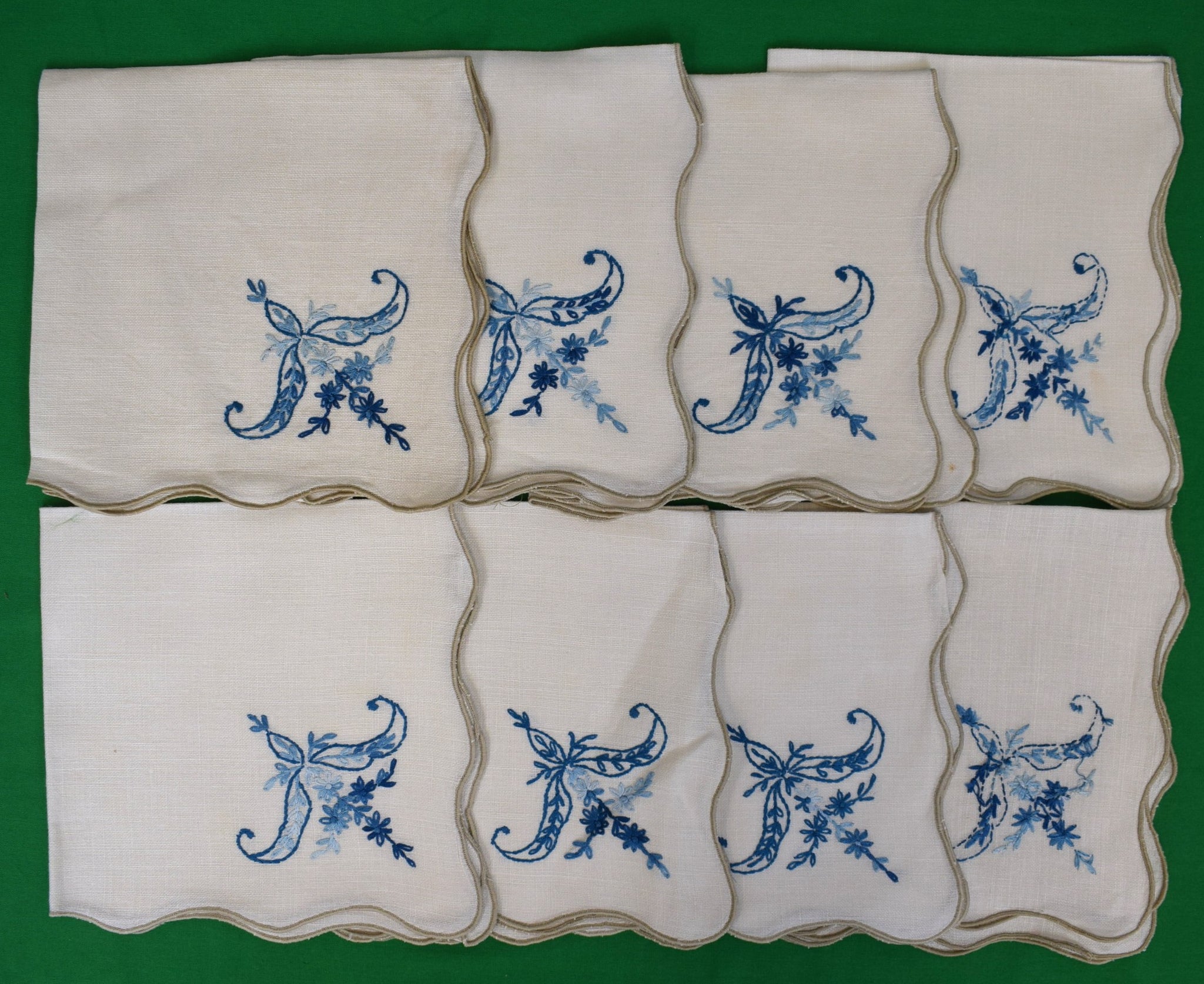 "Set x 8 Oyster Scallop Edge Linen Placemats w/ Blue Embroidered Floral Corner" Provenance: The Susie Hilfiger Collection (SOLD)