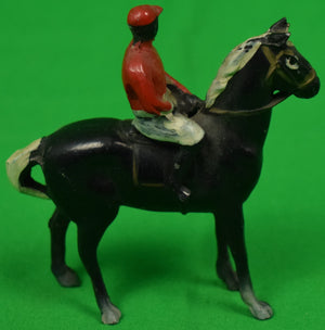 Jockey on Black Racehorse