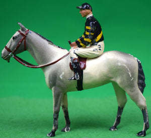 "Britains Jockey w/ Navy/ Yellow Silks on Gray Racehorse"